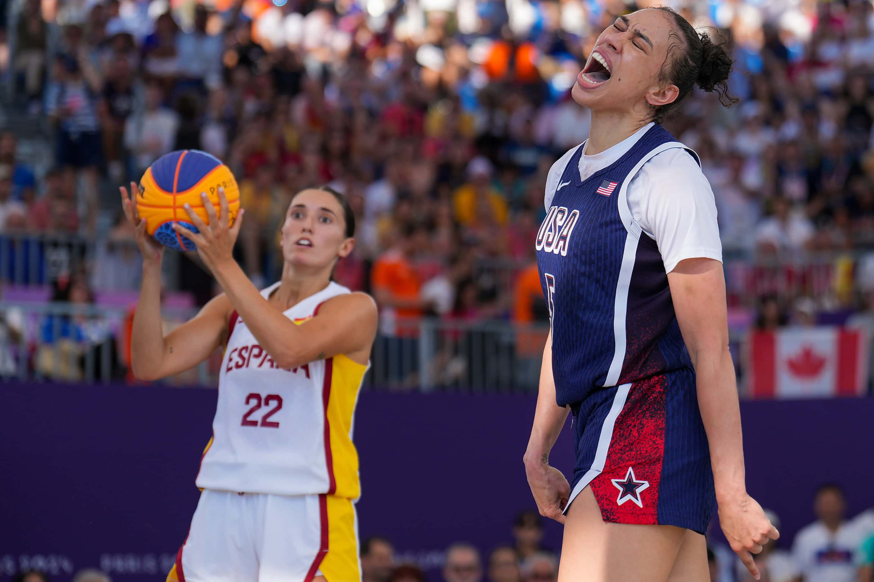 Dearica Hamby (5) of the United States celebrates a basket while being fouled by Spain’s...