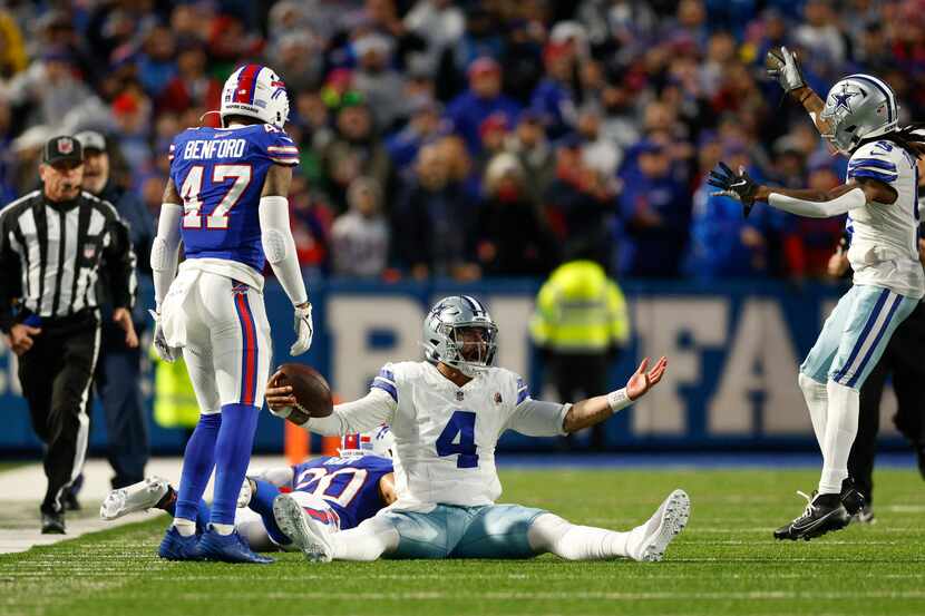 Dallas Cowboys quarterback Dak Prescott (4) reacts after a late hit by Buffalo Bills safety...