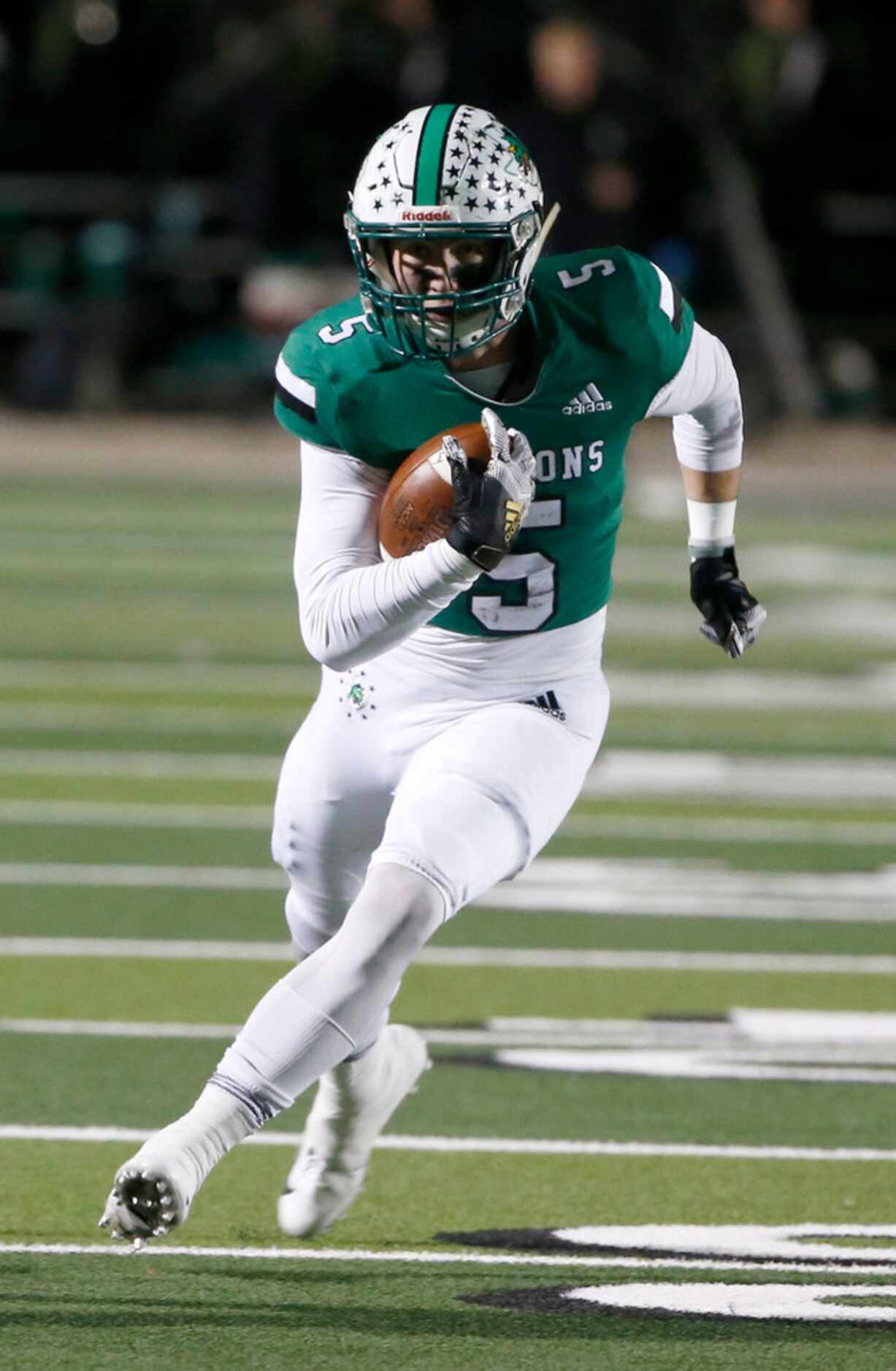 Southlake's Wills Meyer (5) runs against Eaton during the first half of their high school...