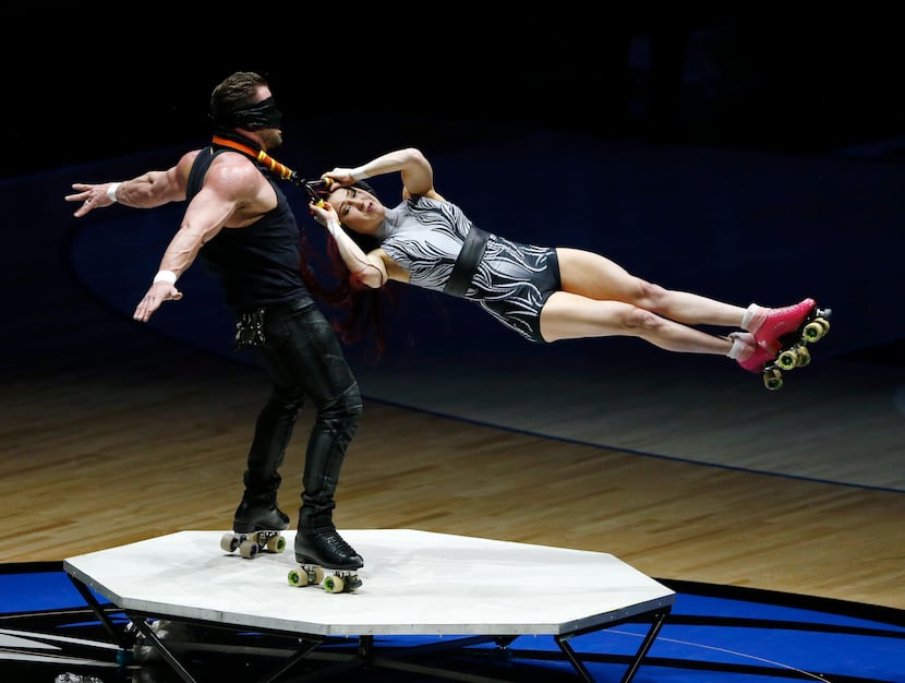Entertainers perform during the halftime show in a game between the Dallas Mavericks and the...