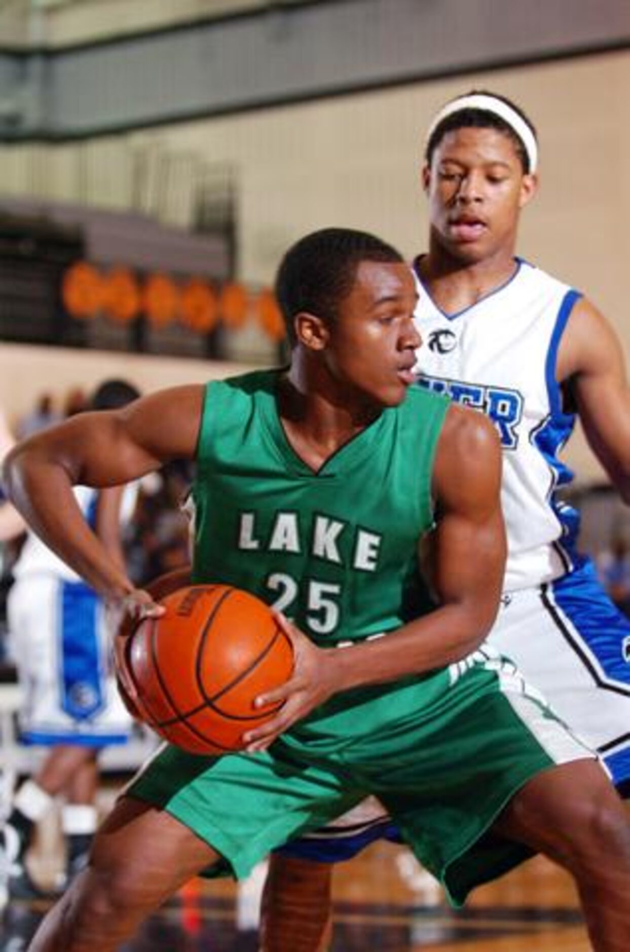 Lake Dallas' Dontonio Jordan (25) tries to get around Guyer's Josh Stewart (3) on Friday,...