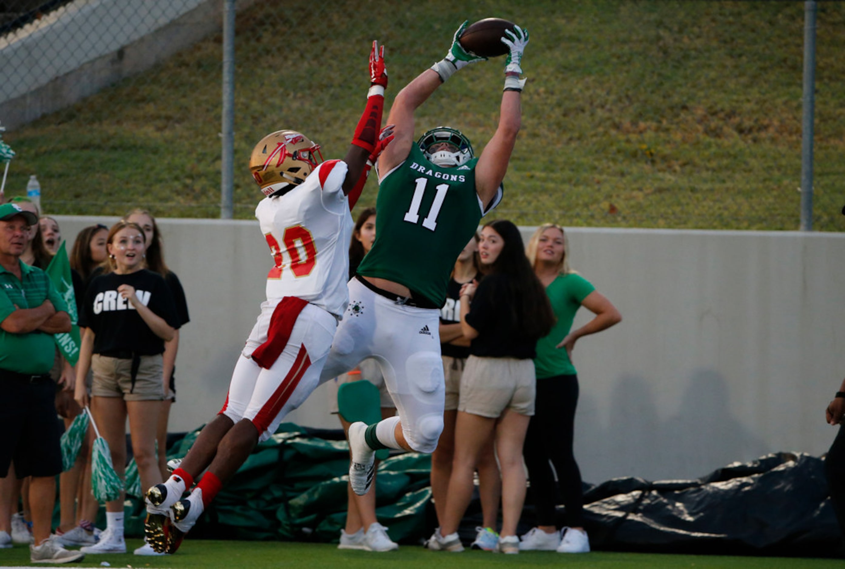 Southlake Carroll's Blake Smith (11) catches a touchdown pass over South Grand Prairie's...