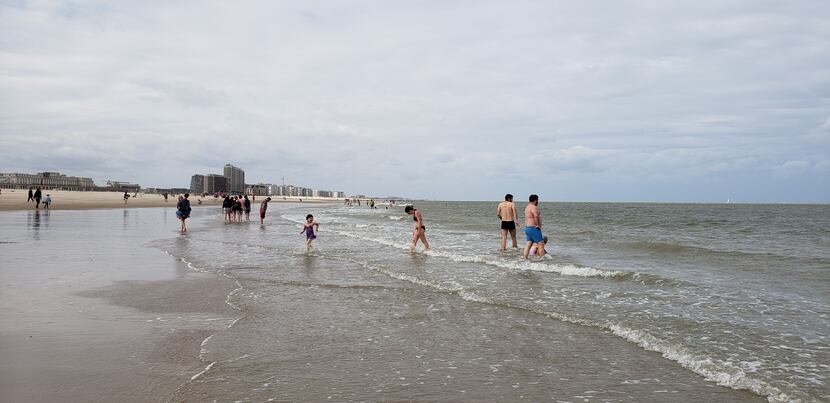 Beachgoers enjoy a cool summer day on the North Sea in Ostend. The city hosts a sand...