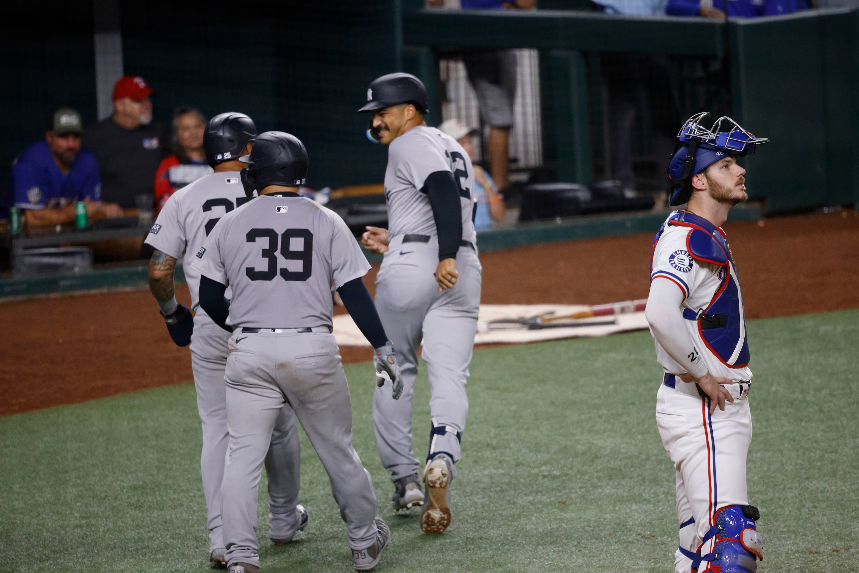 New York Yankees’ Gleyber Torres (25), from left, Jose Trevino (39) and Trent Grisham (12)...