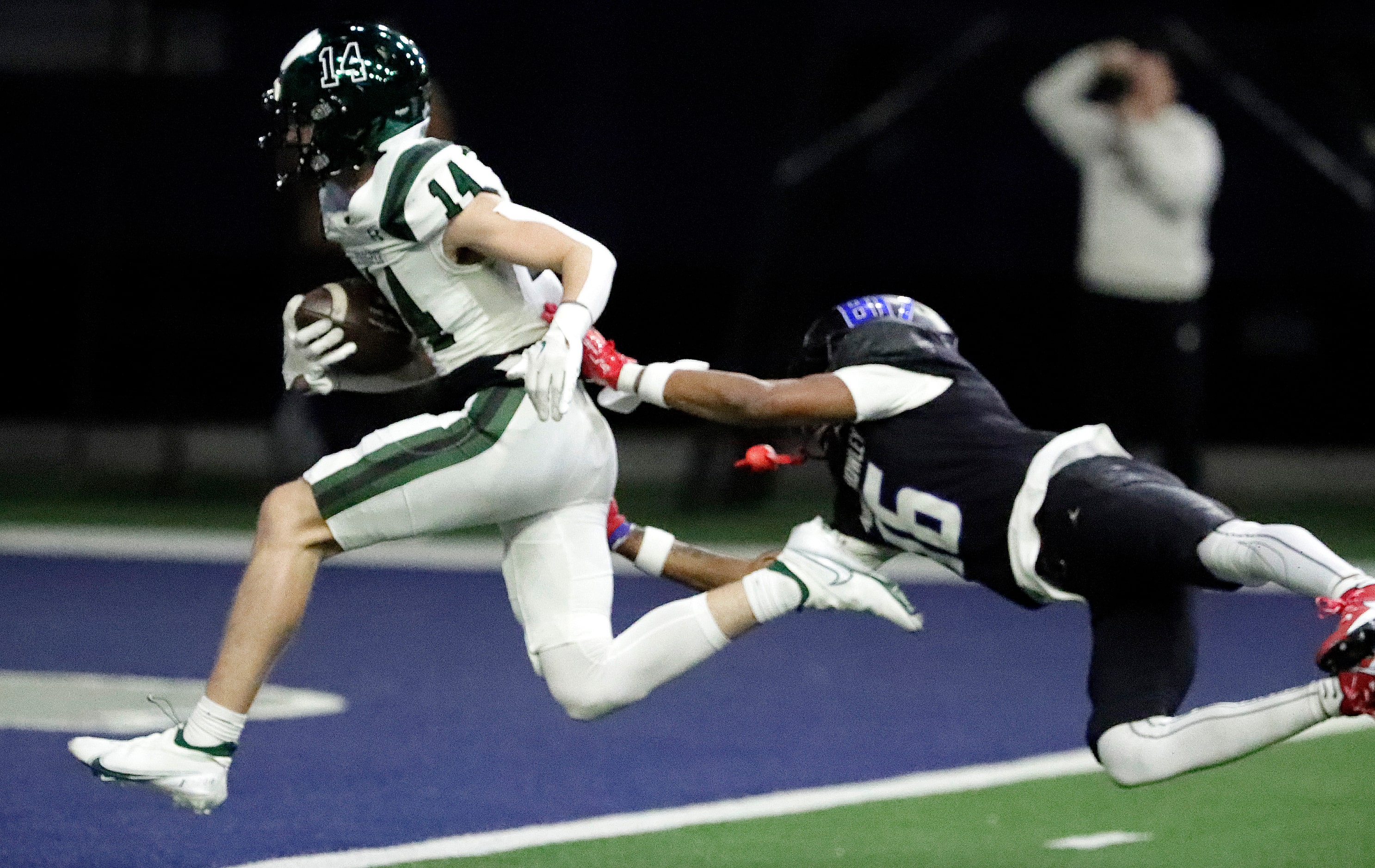 Prosper High School wide receiver Austin Hailey (14) runs past North Crowley High School...