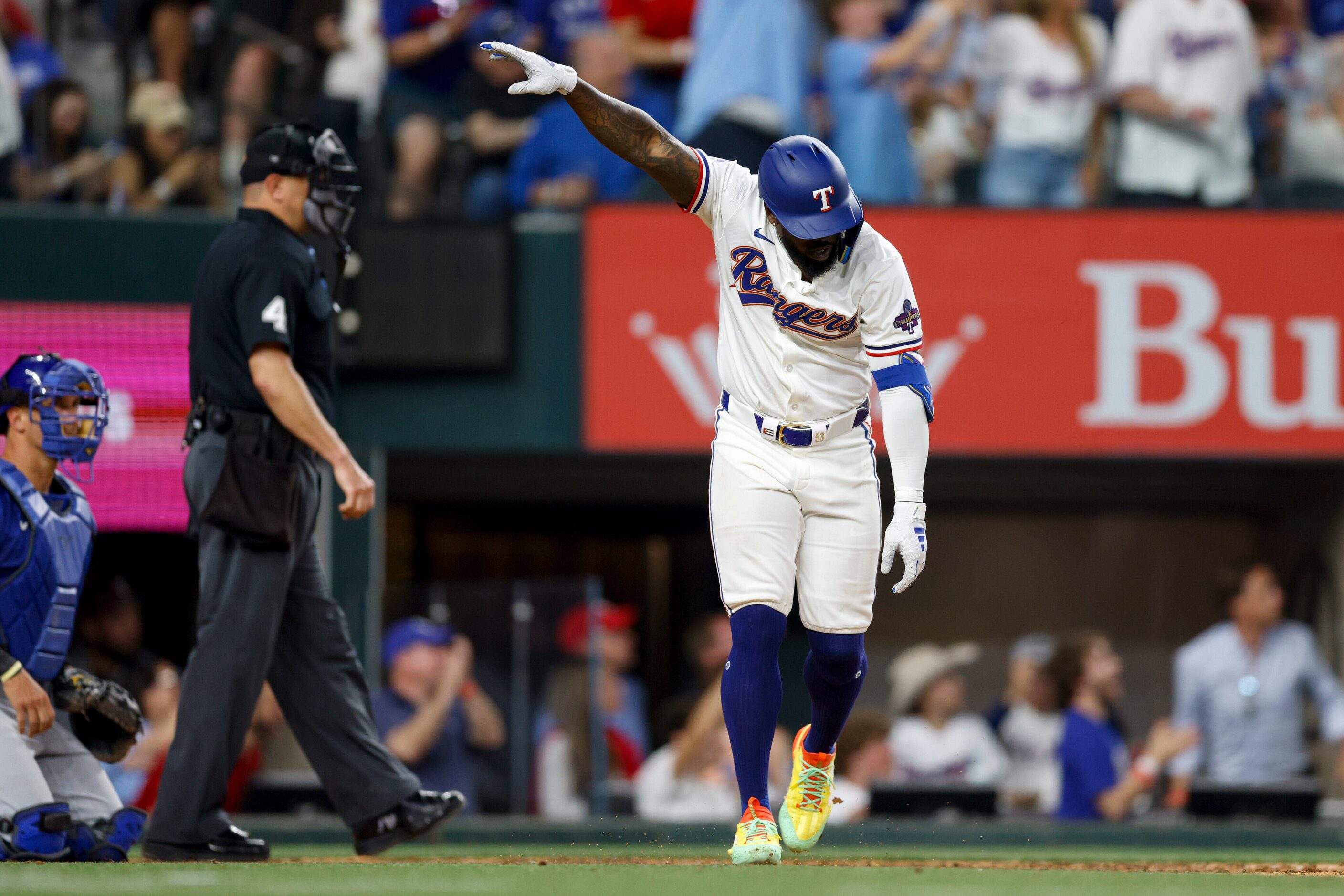 Texas Rangers right fielder Adolis Garcia (53) tosses his bat after hitting a solo home run...