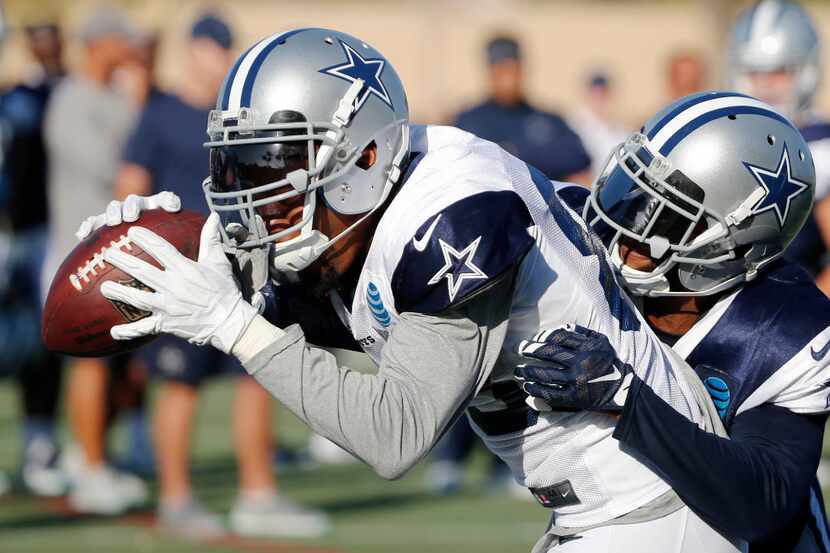 Dallas Cowboys wide receiver Terrance Williams (83) holds onto the ball as Dallas Cowboys...