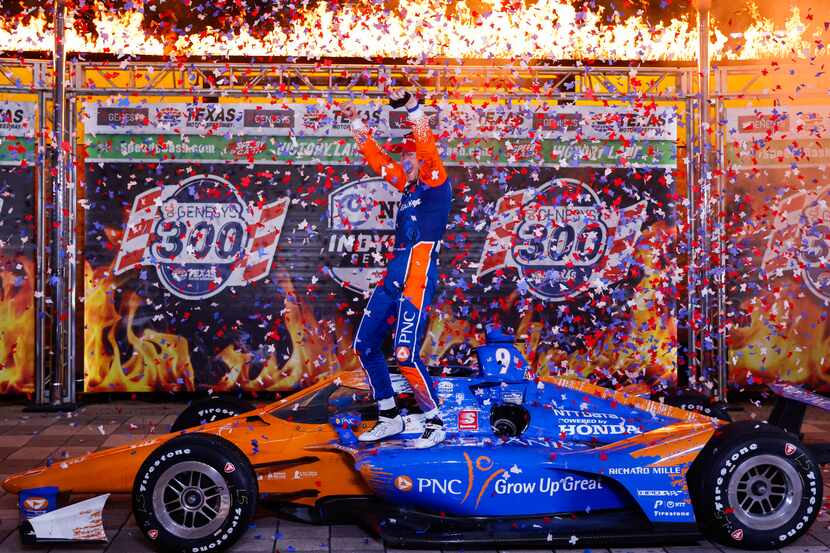 Scott Dixon (#9) celebrates in Victory Lane after winning the IndyCar Genesys 300 race at...