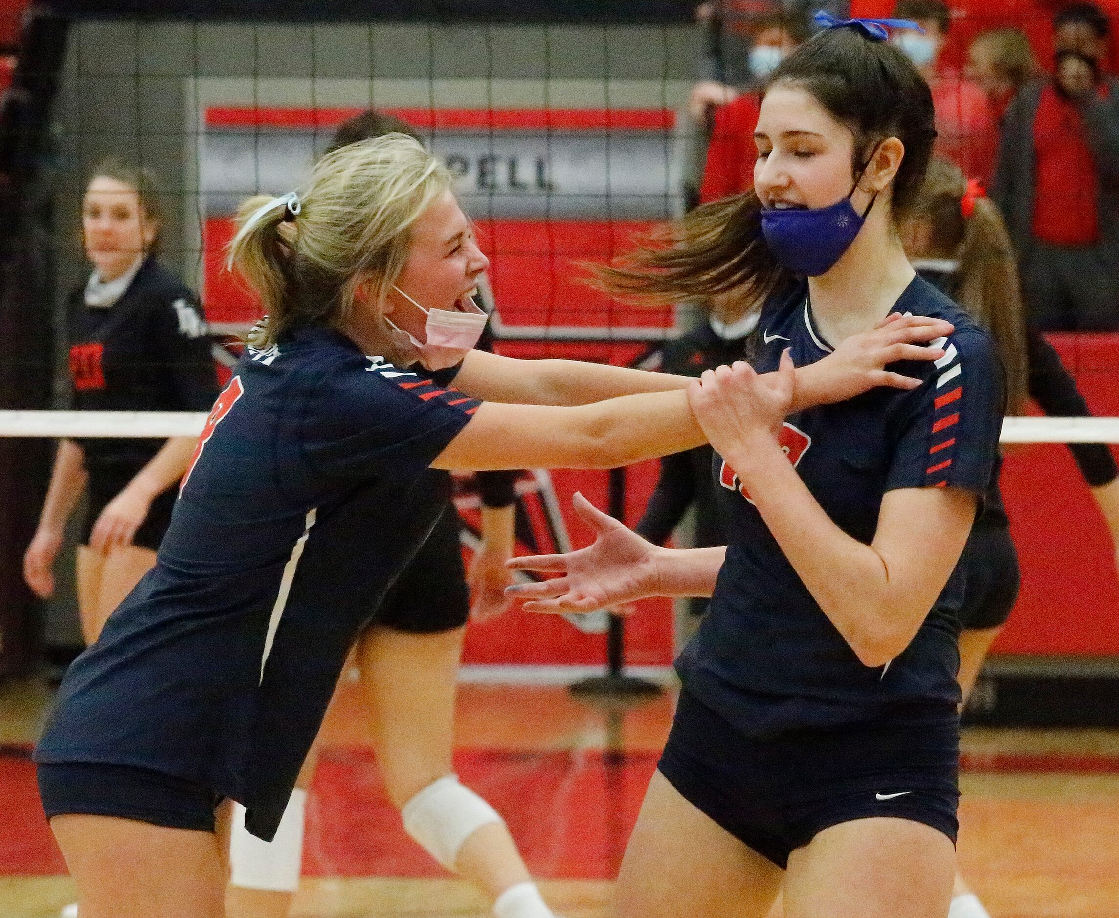 Grapevine High School defensive specialist Avery Miles (8) congratulates Grapevine High...