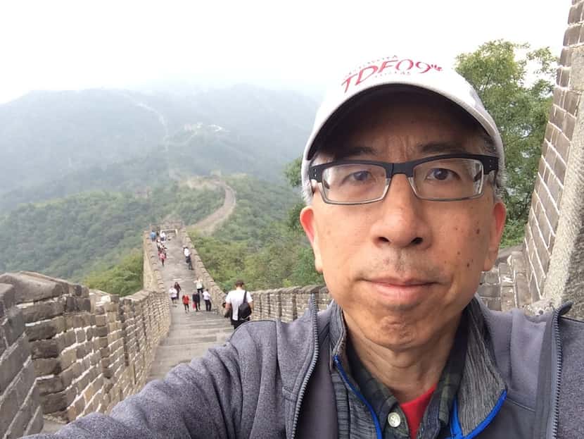 Thomas Huang, an editor at The Dallas Morning News, climbs the ascent of the Mutianyu...