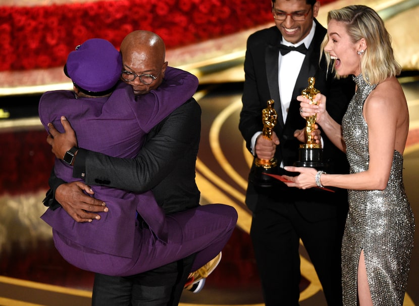 Spike Lee, winner of the award for best adapted screenplay for "BlacKkKlansman" jumps into...