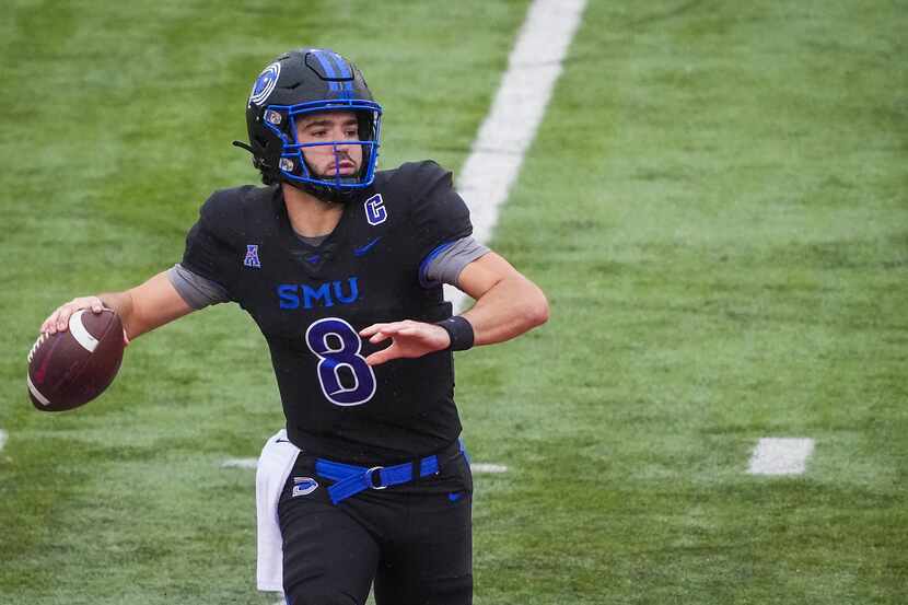 SMU quarterback Tanner Mordecai throws a pass during the first half of an NCAA football game...