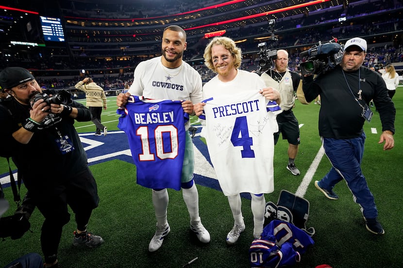 FILE - Cowboys quarterback Dak Prescott (left) exchanges jerseys with Bills wide receiver...