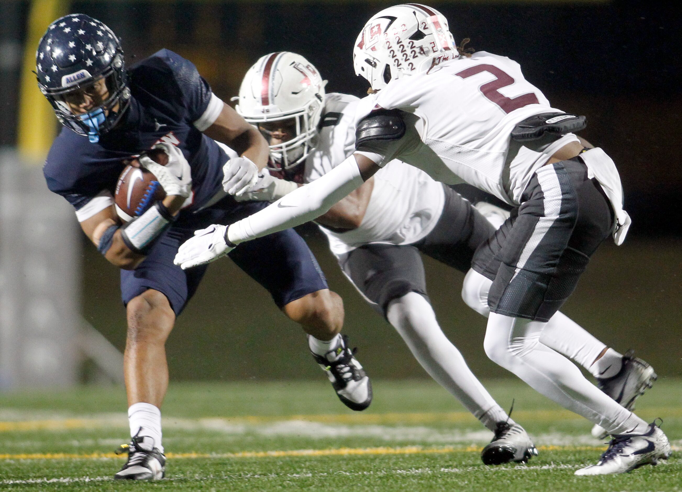 Allen receiver Quentin House-Hammonds (5), left, pulls in a first quarter reception before...