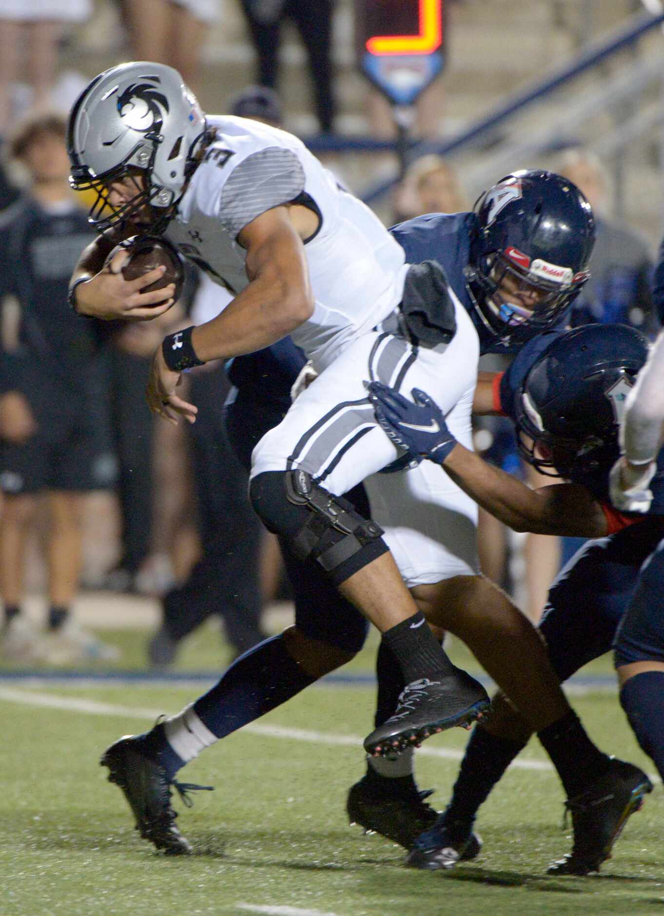 Denton Guyer’s Eli Stowers (3) looks for running room in the third quarter of a high school...