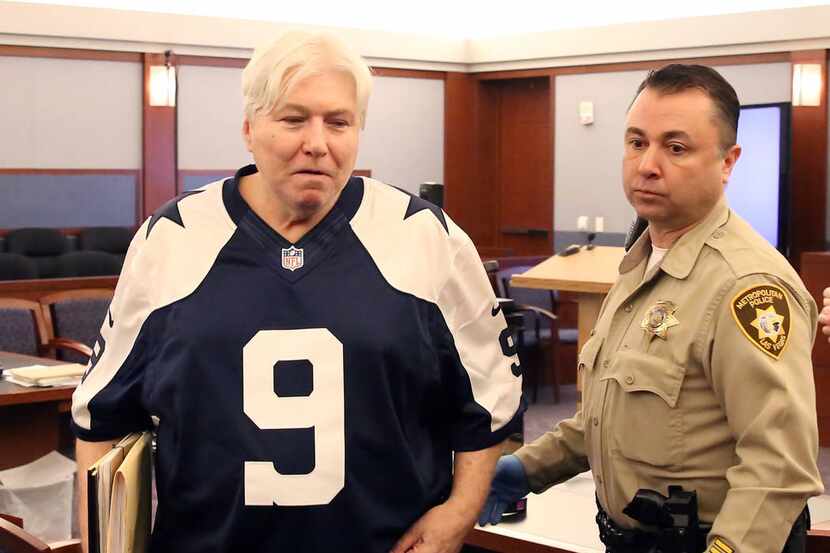 Thomas Randolph, wearing a Tony Romo jersey, leaves the courtroom after appearing in his...