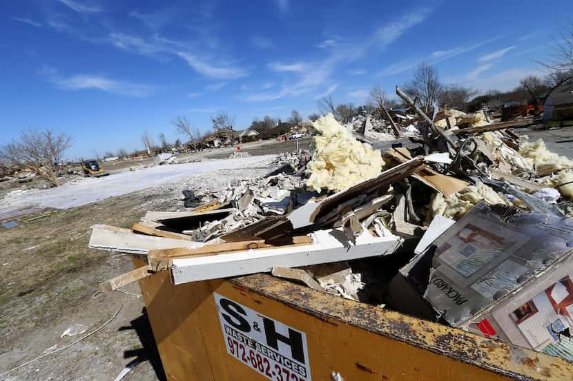 
Debris was loaded up and ready to haul off Thursday from the site of a Garland home that...