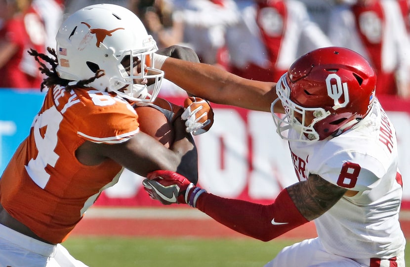 FILE - Texas Longhorns wide receiver Lil'Jordan Humphrey (84) is grabbed by Oklahoma Sooners...