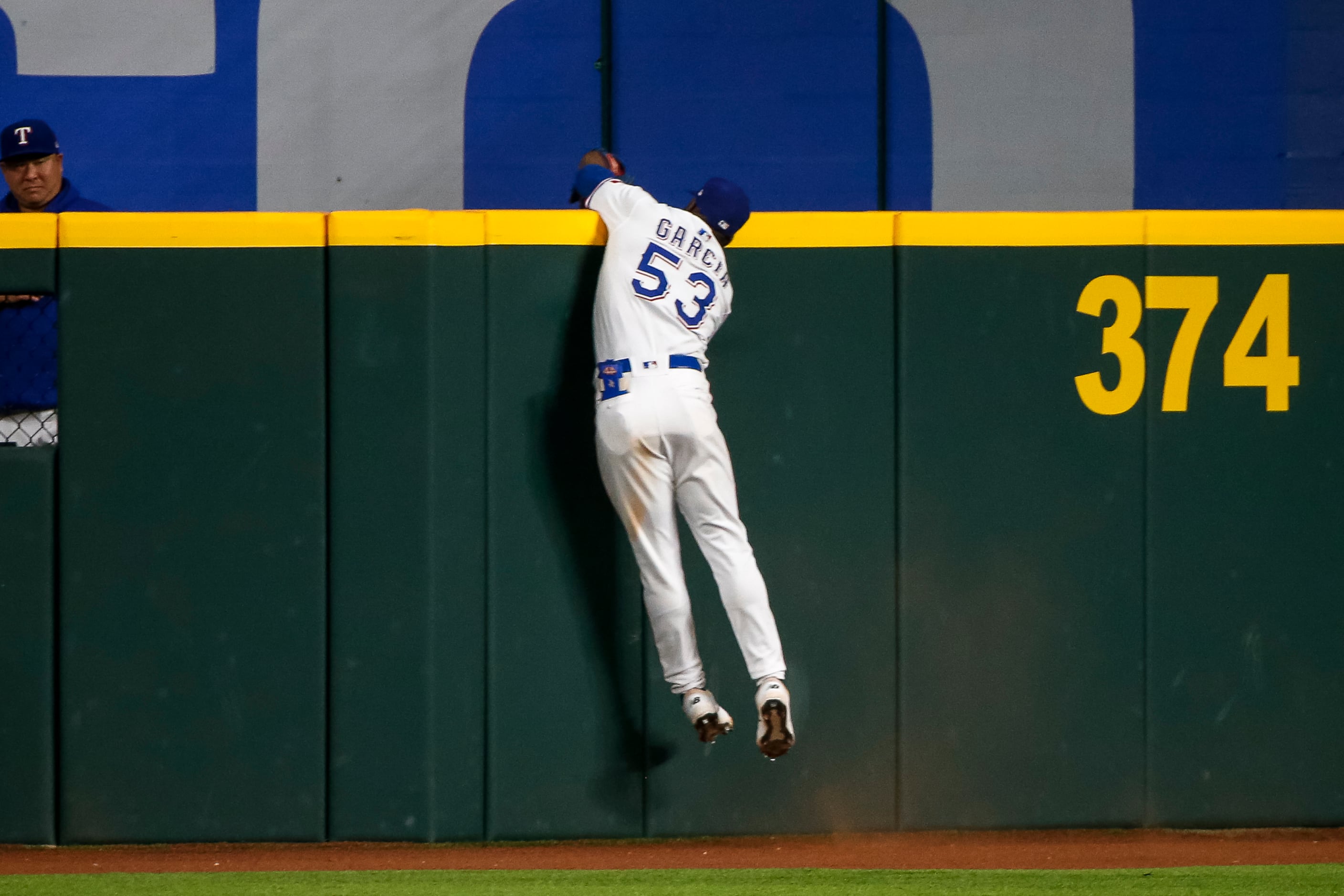 Rookies lead Rangers past Angels 5-2 to avoid 100th defeat