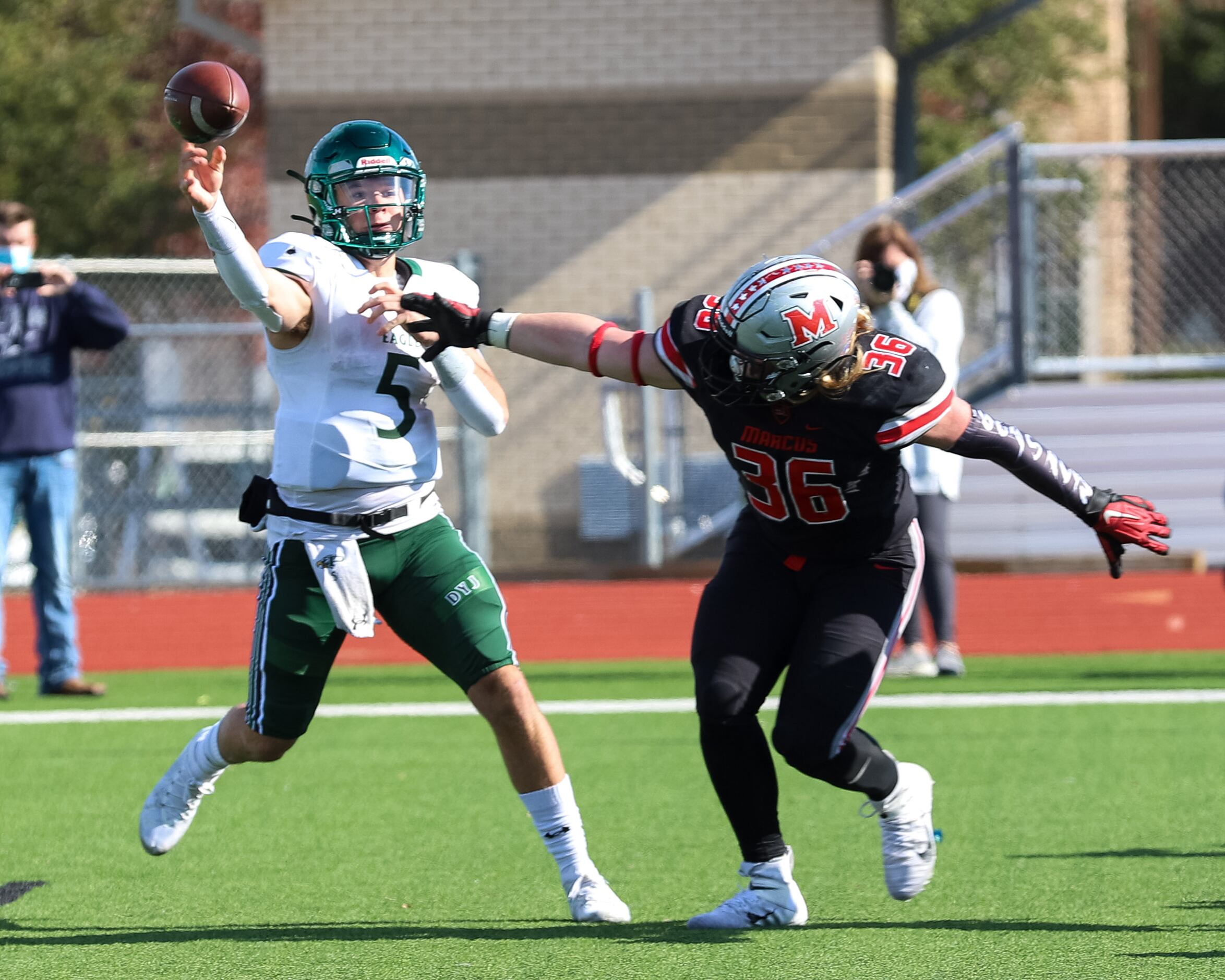 Prosper’s Jackson Berry (5) throws a pass over Flower Mound Marcus defensive lineman Ty...
