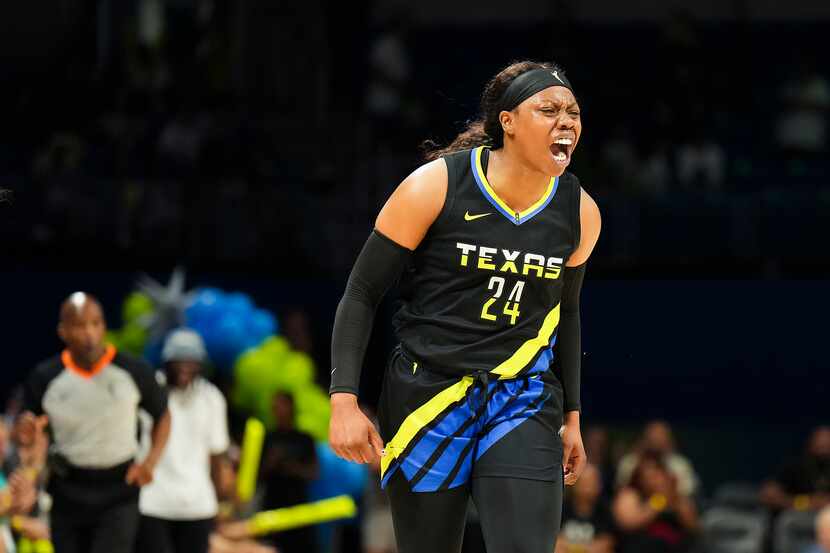 Dallas Wings guard Arike Ogunbowale (24) celebrates after hitting three-pointer during the...