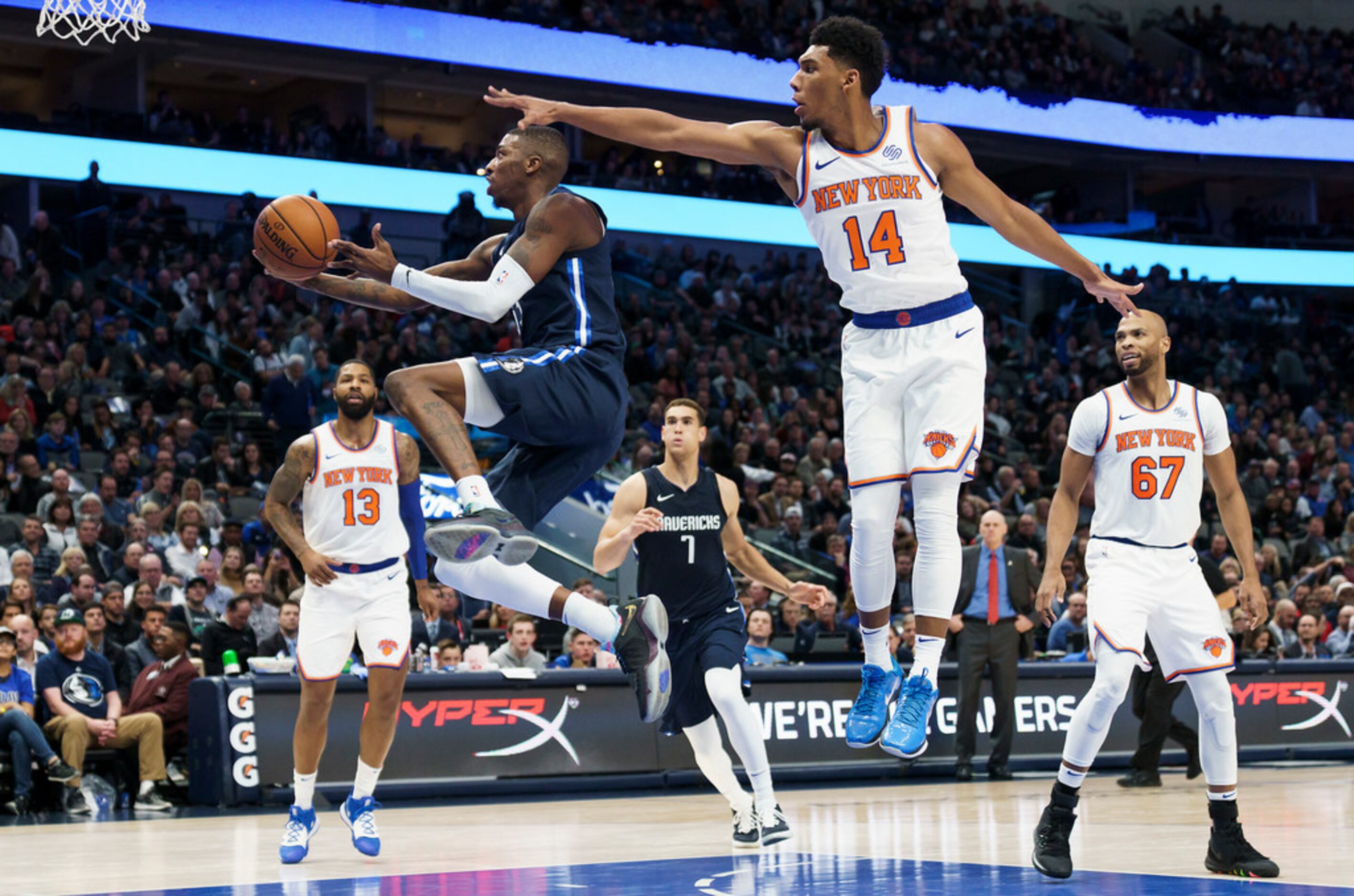 Dallas Mavericks guard Delon Wright (55) drives to the basket past New York Knicks guard...