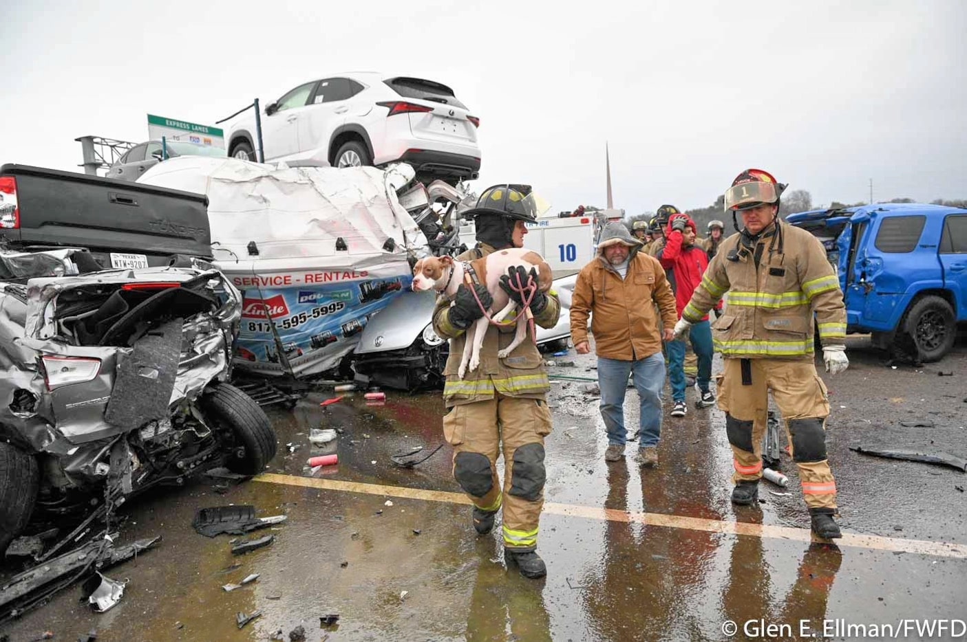 Fort Worth firefighters rescued a man and his dog fro ma pile of crushed vehicles and semi...