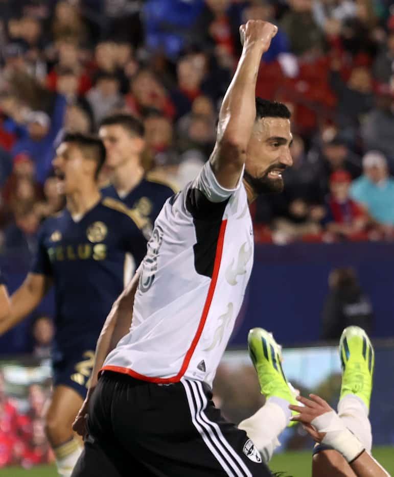 FC Dallas midfielder Sebastian Lietget (8) pumps his fist after scoring a goal during first...