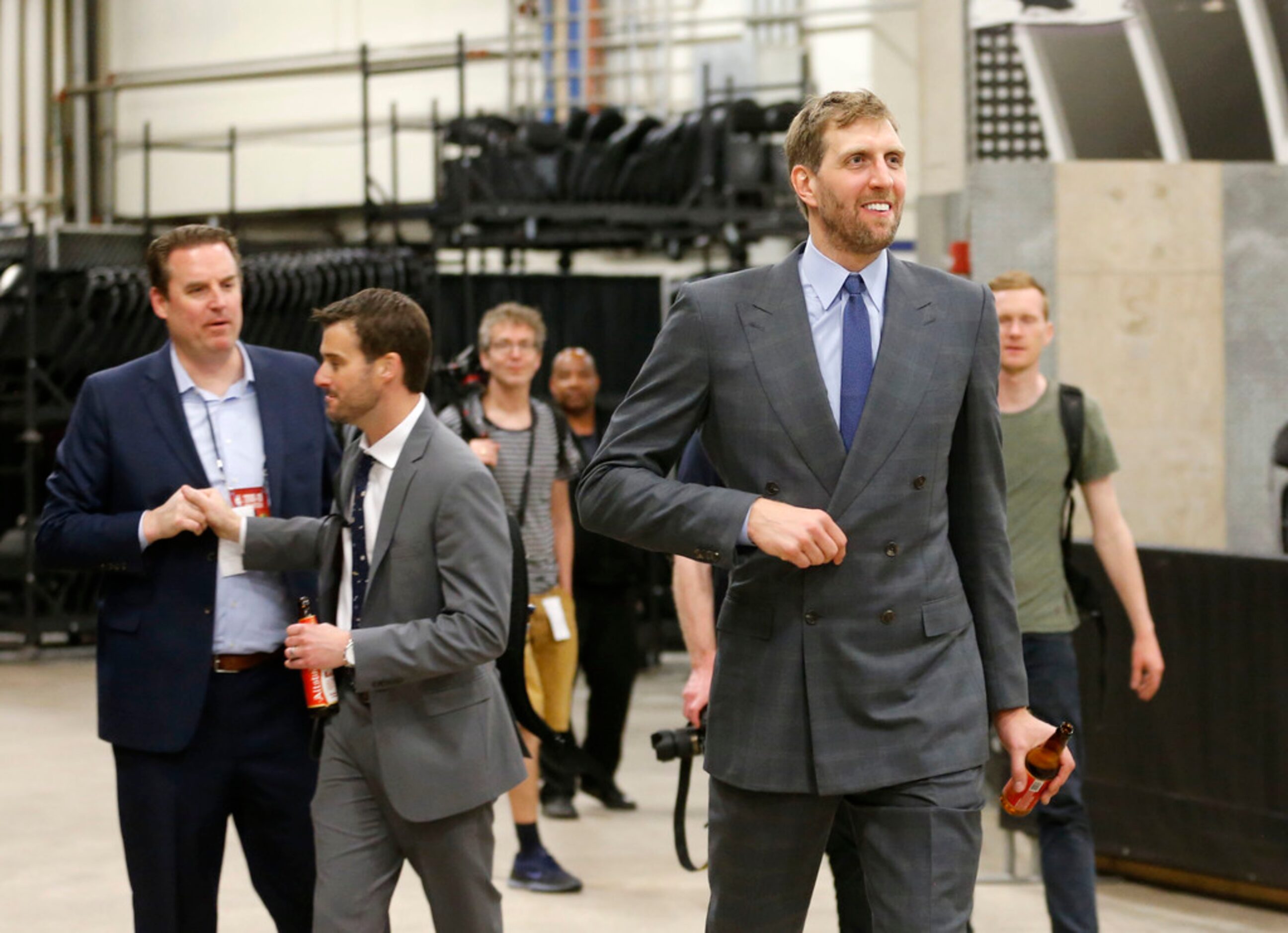 Dallas Mavericks forward Dirk Nowitzki (41) makes his way to the bus after giving his last...