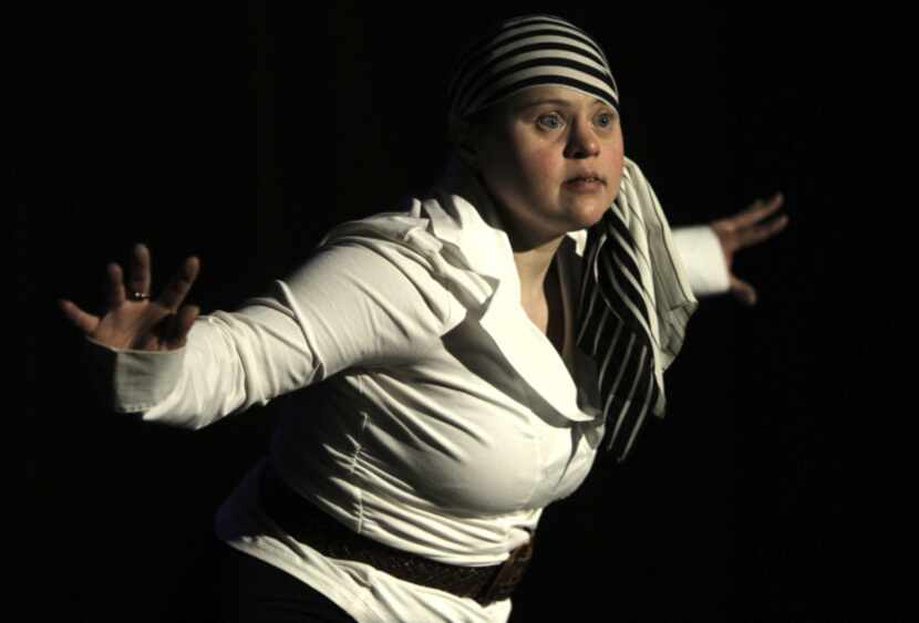 Jessica Smith performs a dance onstage during a dress rehearsal for the Jesters of Highland...