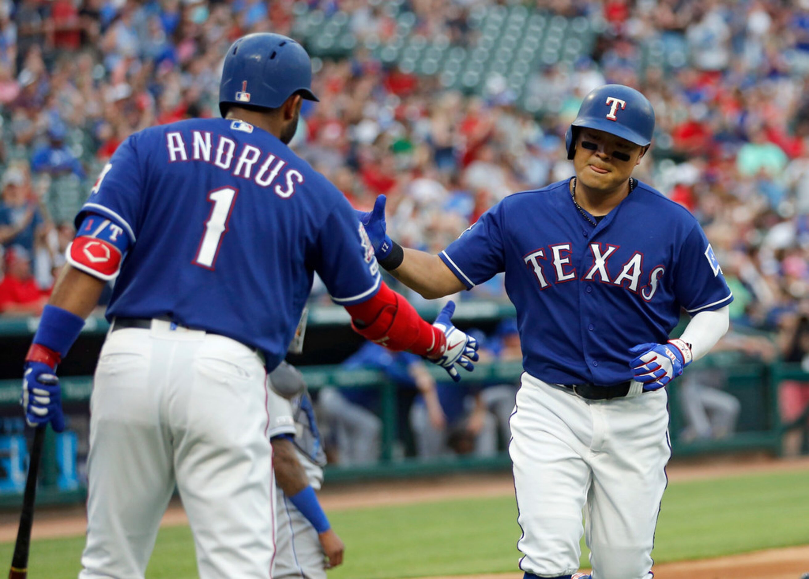 Texas Rangers shortstop Elvis Andrus (1) congratulates Texas Rangers right fielder Shin-Soo...