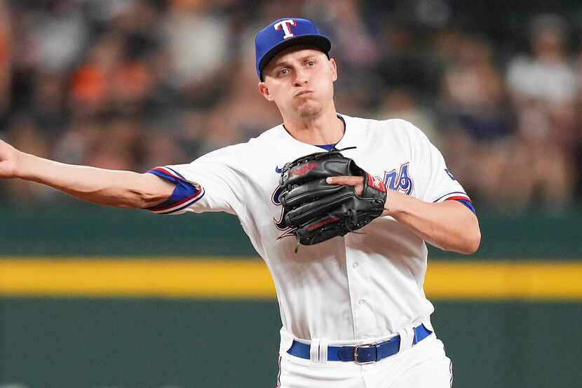 Texas Rangers shortstop Corey Seager (5) makes the relay over Baltimore Orioles third...