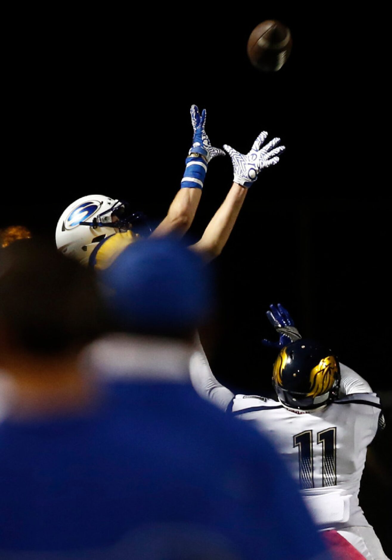 Sunnyvale coaches watch as wide receiver Cash Goodhart (2) goes up for the ball as Life Oak...