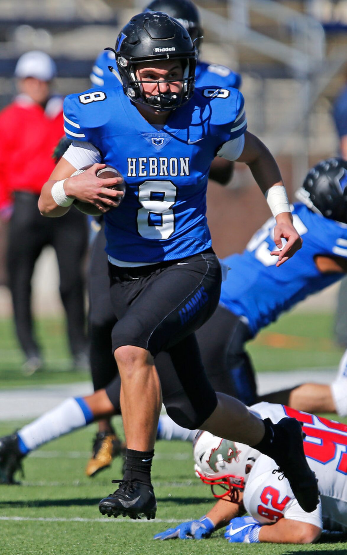 Hebron High School quarterback Carson Harris (8) scored a touchdown on this run during the...