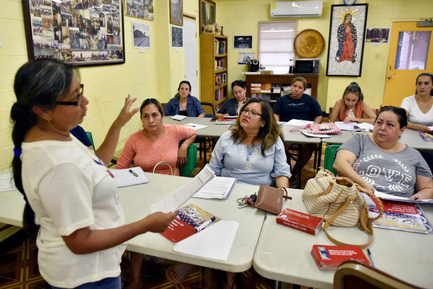 Instructor Jacinta Hernandez, left, conducts a lesson during a citizenship class at Casa...