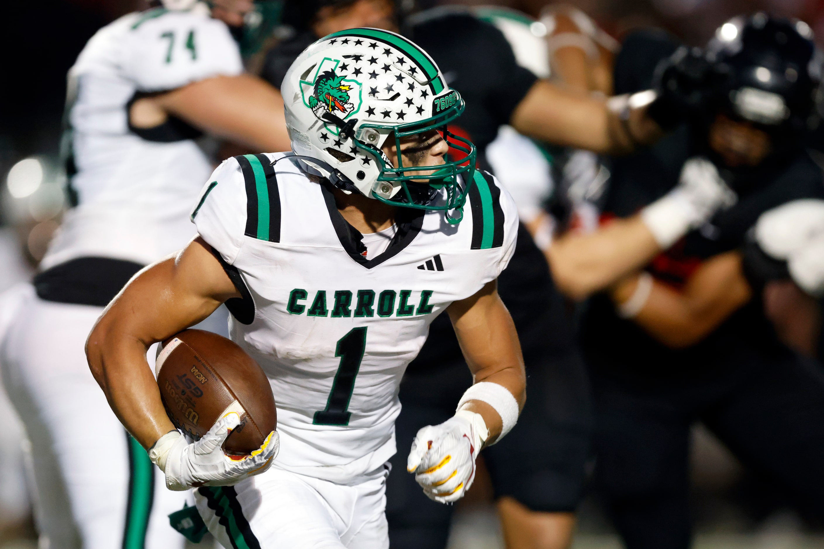 Southlake Carroll running back Riley Wormley (1) runs the ball during the first half of a...