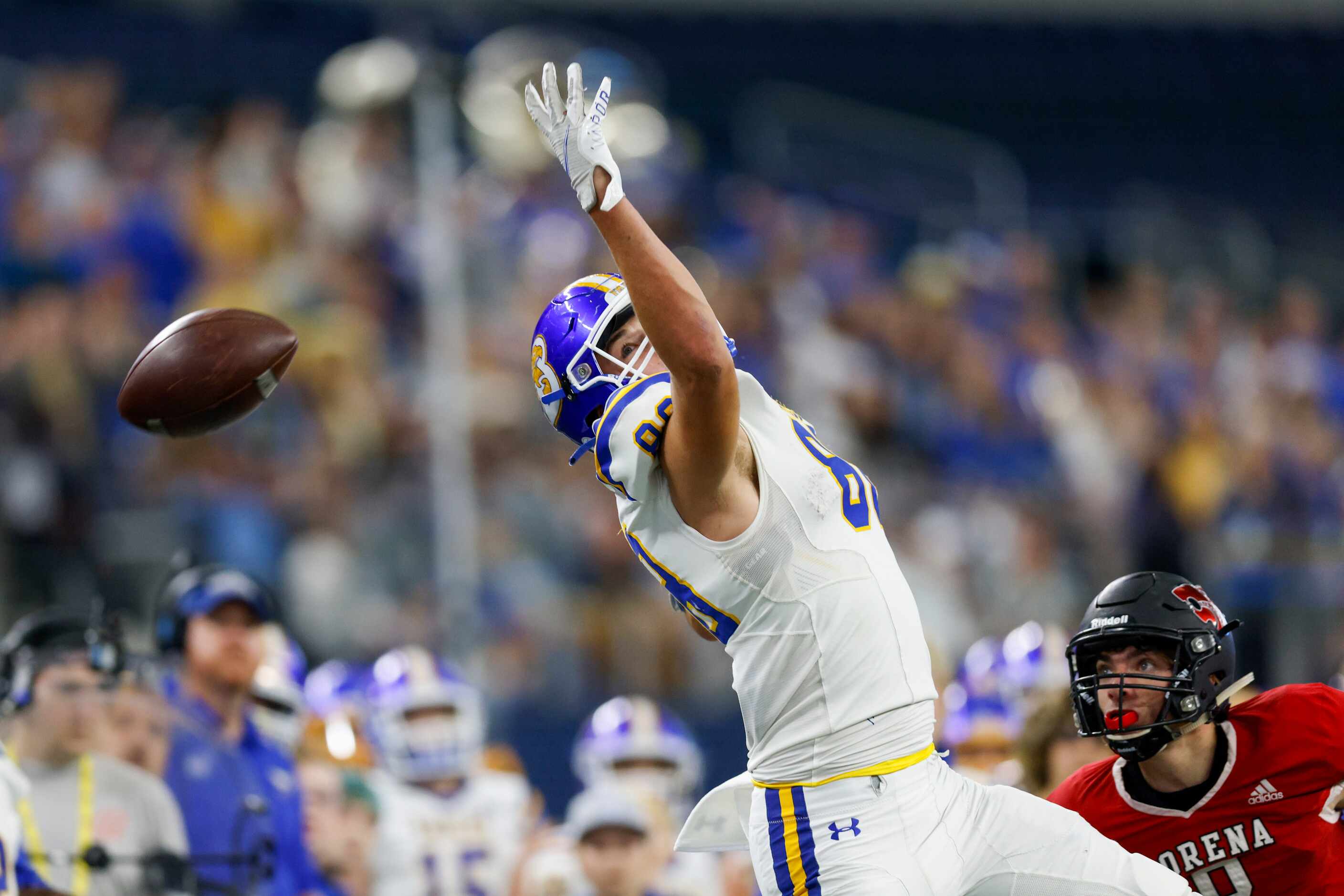 A pass flies over the outstretched arm of Brock tight end Nathan Jones (88) during the first...