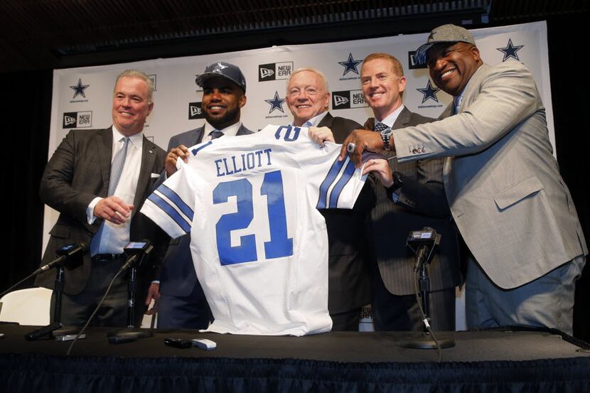 The Dallas Cowboys' first-round draft pick, Ezekiel Elliott, second from left, poses for...