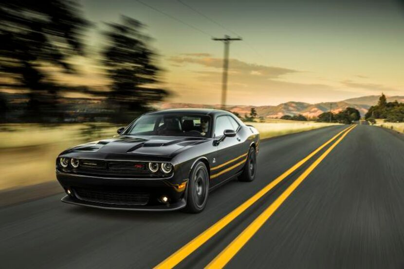 
The 2015 Dodge Challenger R/T 6.4 Scat Pack has a two-piece front grille and horizontal...