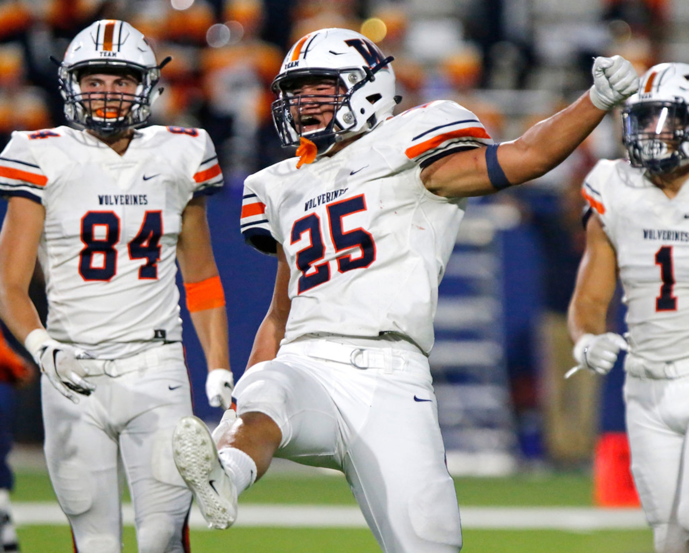 Wakeland High School linebacker Robbie Williams (25) celebrates a sack during the first half...