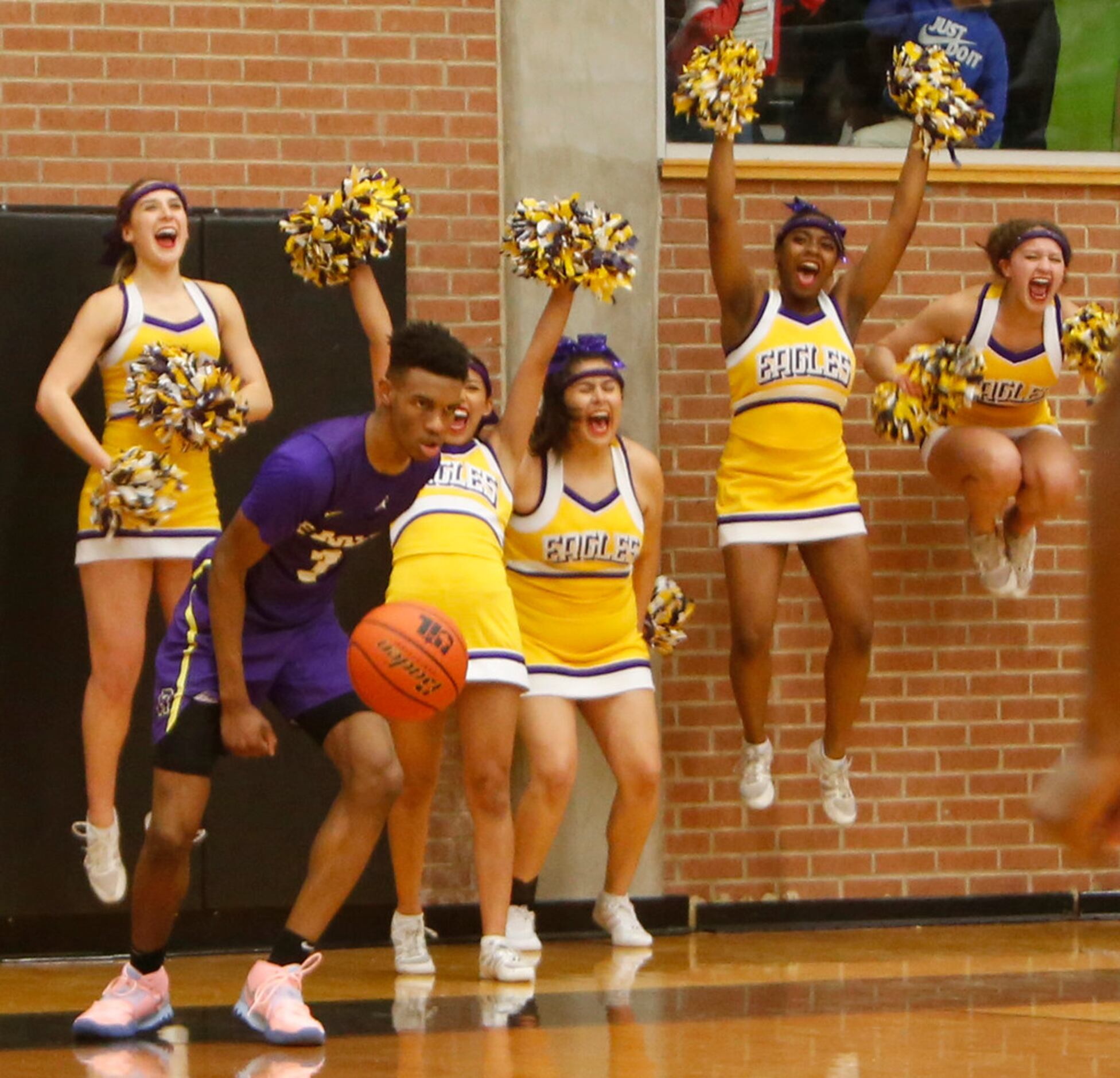 Richardson guard Rylan Griffen (3) ignites the Eagles cheerleaders following a thunderous...