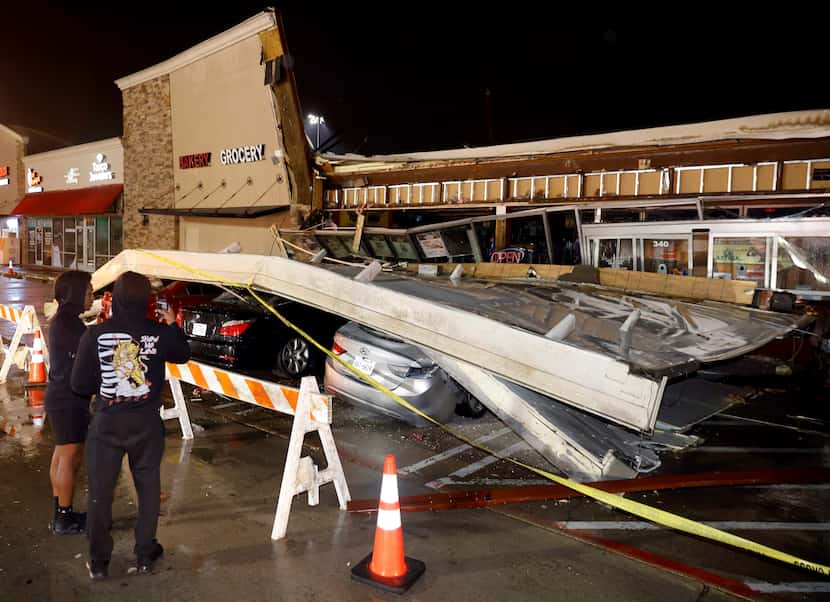The roof of the La Azteca grocery store on W. Eldorado Parkway peeled off and landed on a...