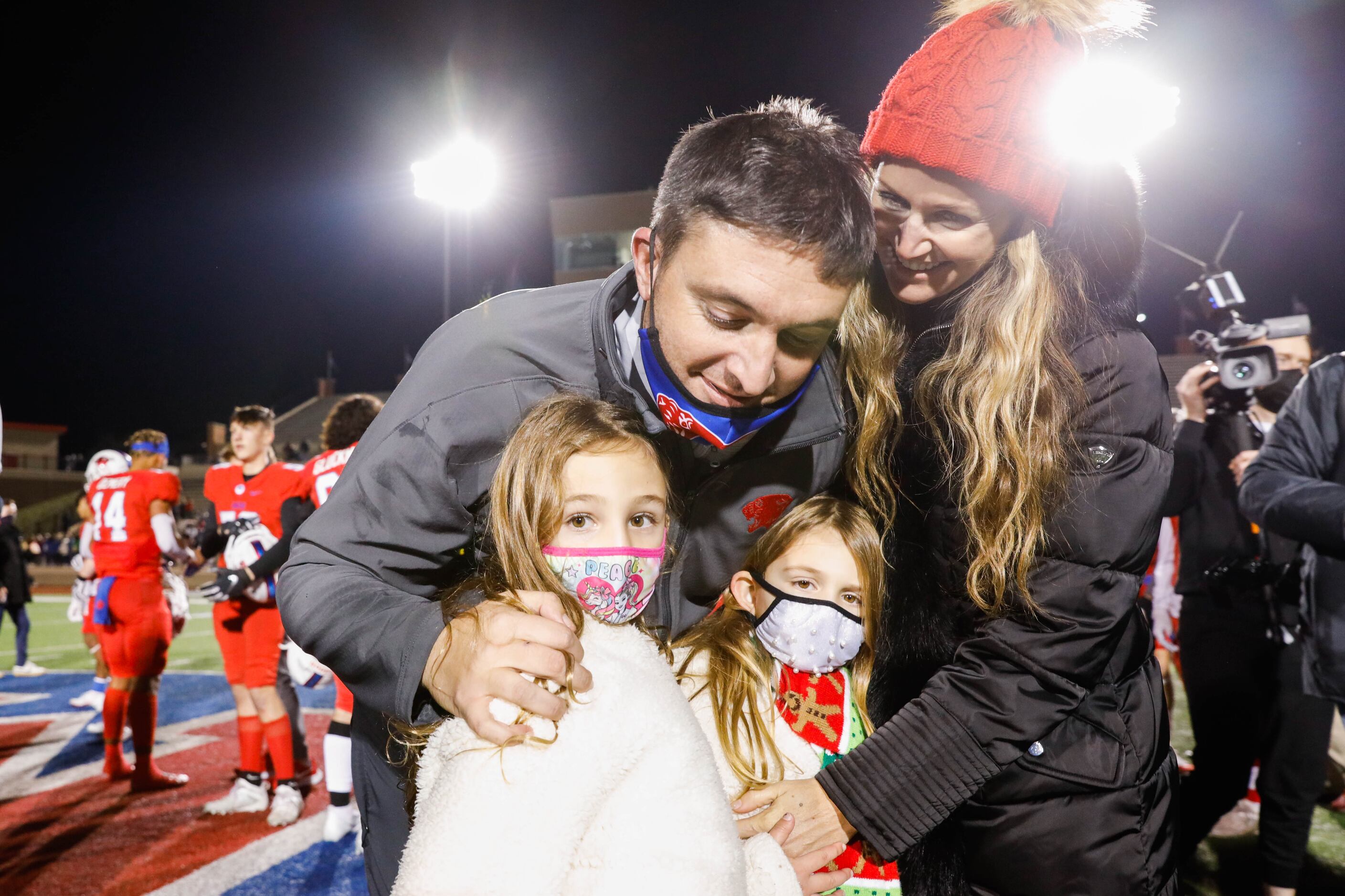 Parish Episcopal's coach Daniel Novakov celebrates his win with his family after winning the...