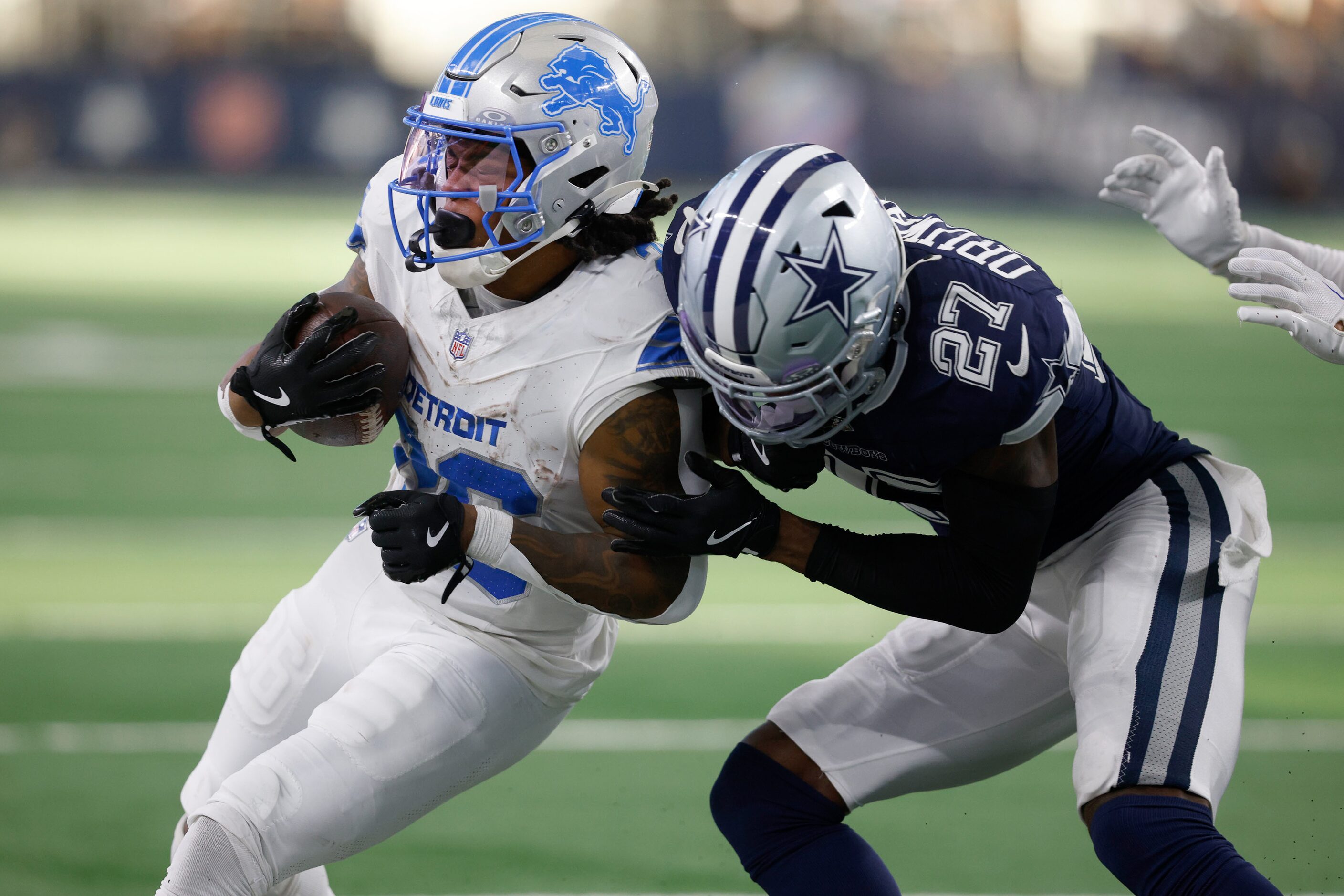 Detroit Lions running back Jahmyr Gibbs (26) is tackled by Dallas Cowboys cornerback Amani...