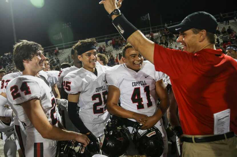 The Coppell Cowboys celebrate their 16-15 win over the Hebron Hawks on Friday, Oct. 5, 2018...