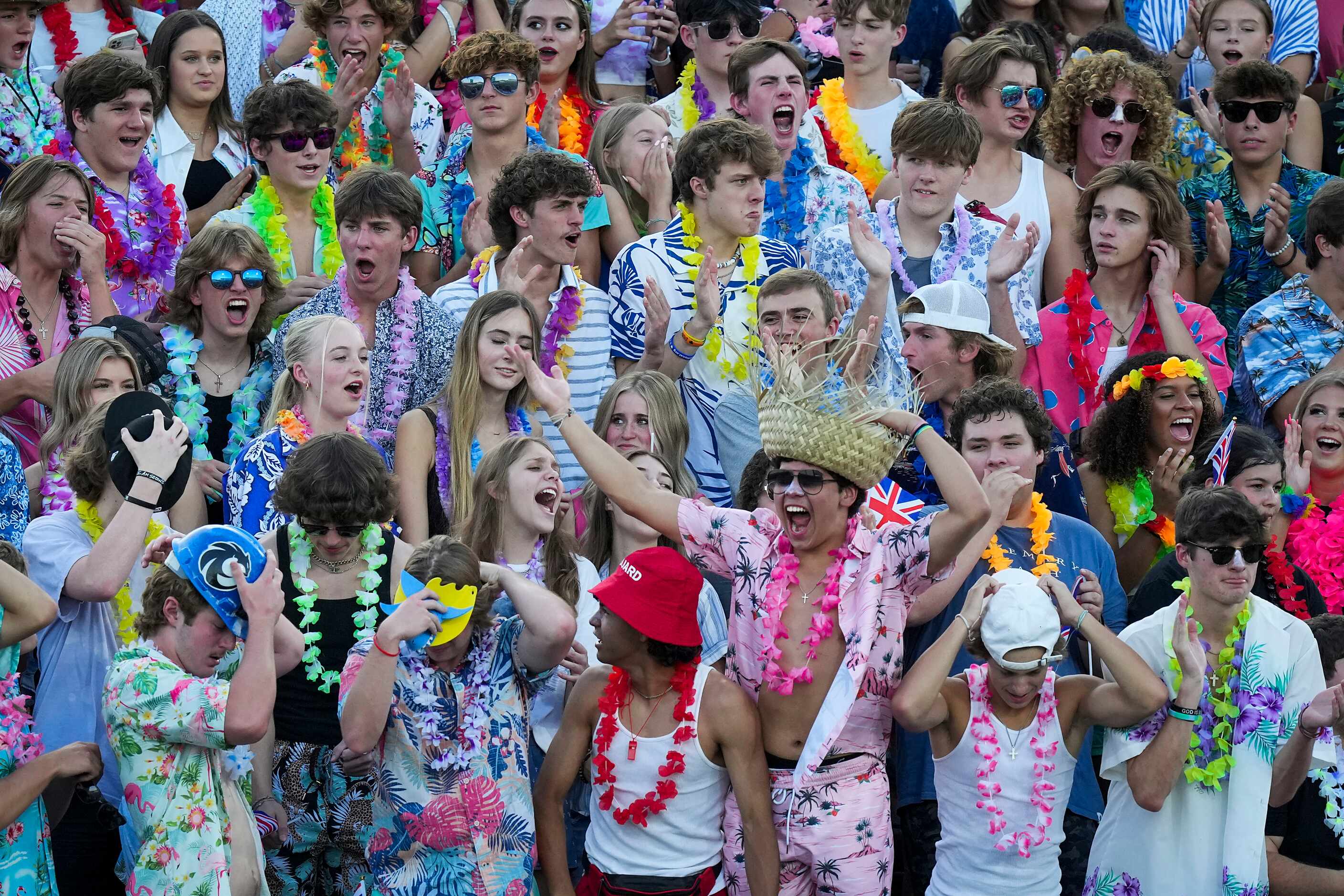 Denton Guyer students cheer their team during the first half of a high school football game...