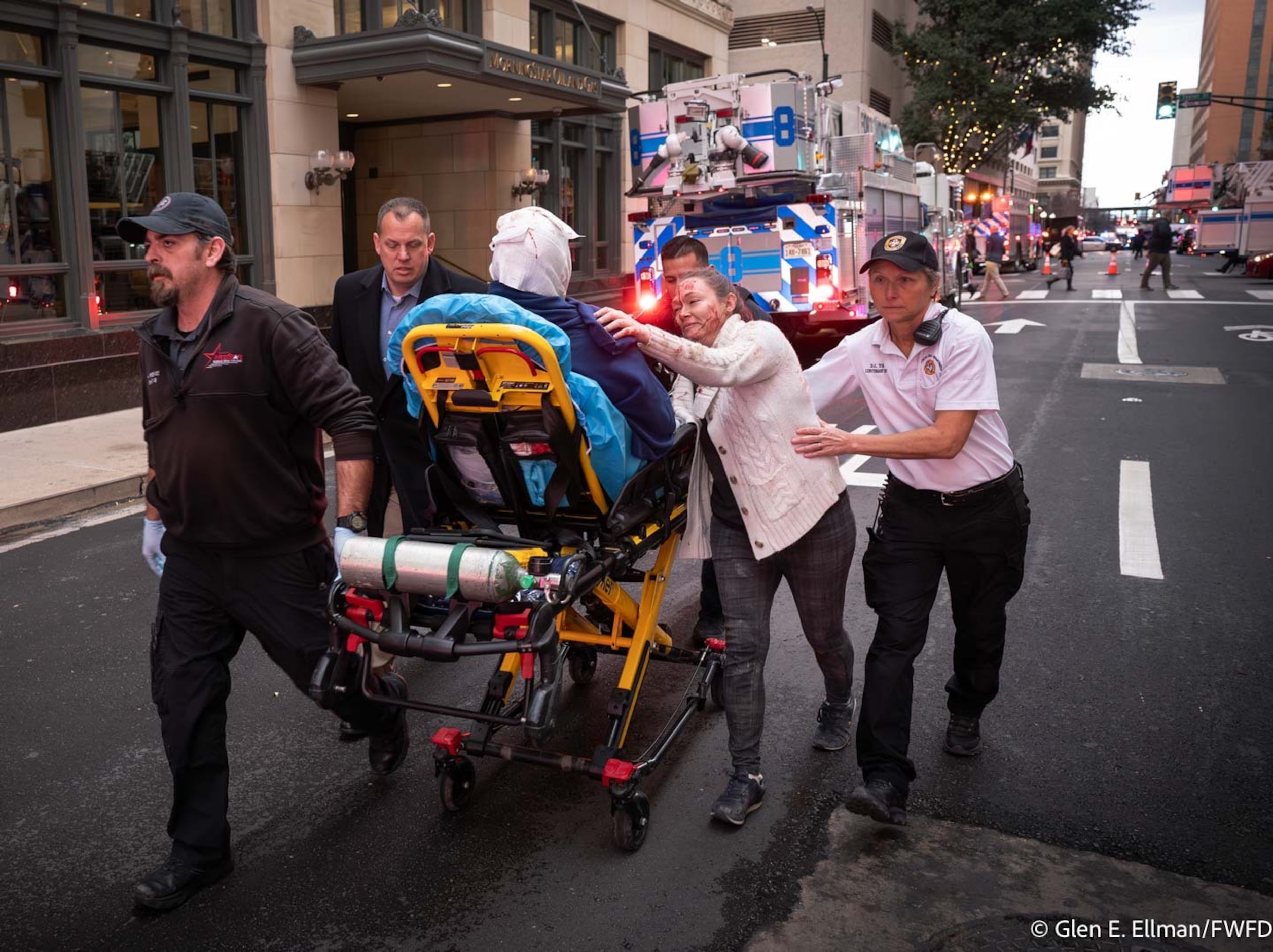 An injured person receives medical attention following an explosion at the Sandman Signature...