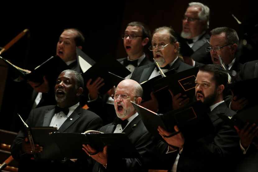 Dallas Symphony Chorus performs while Jaap Van Zweden conducts Symphony No. 9 by Beethoven...