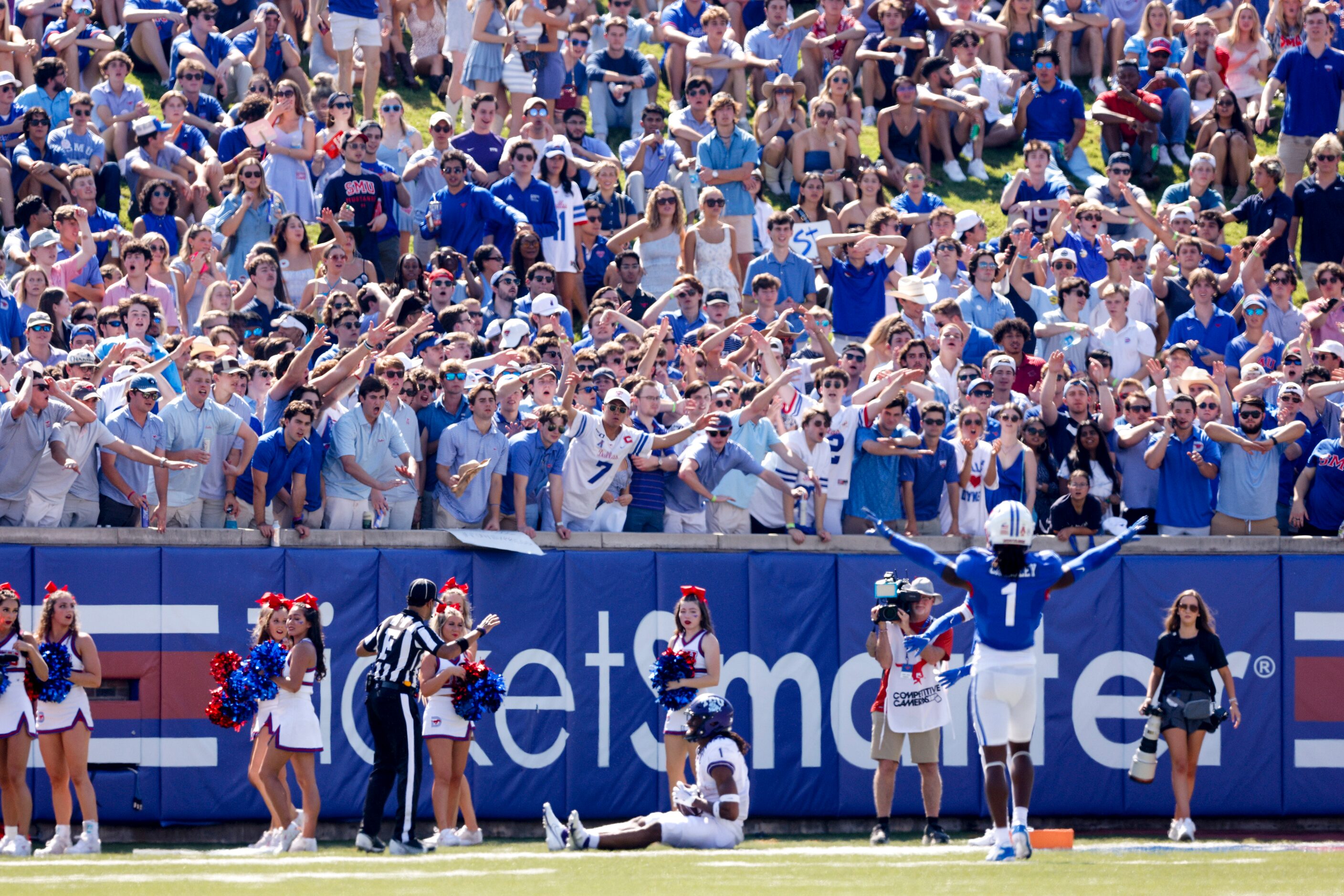 SMU fans celebrate an incomplete pass during the first half of a game against TCU at Ford...