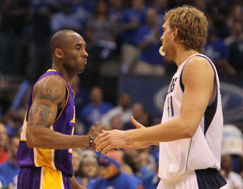 Los Angeles' Kobe Bryant and Dallas' Dirk Nowitzki shake hands before during Game 4 of the...